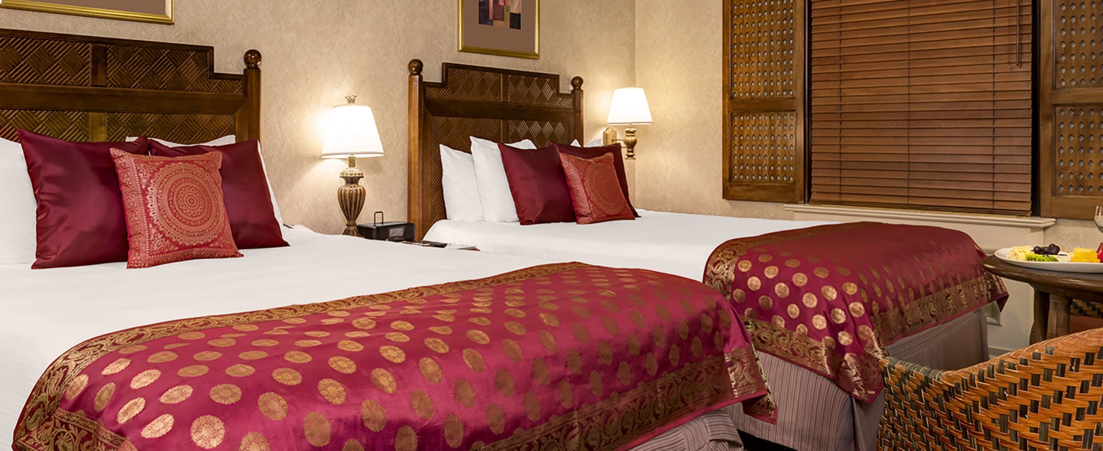 This premium room has too queen beds and a bistro table.